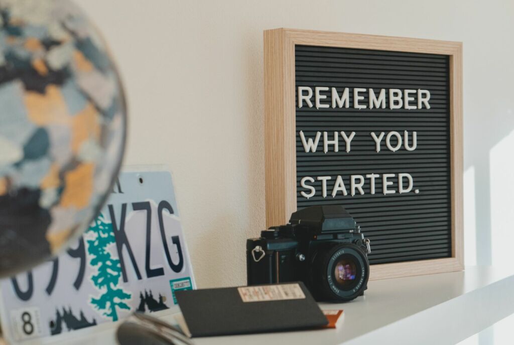 A board with a Motivational Quote saying Remember Why You Started