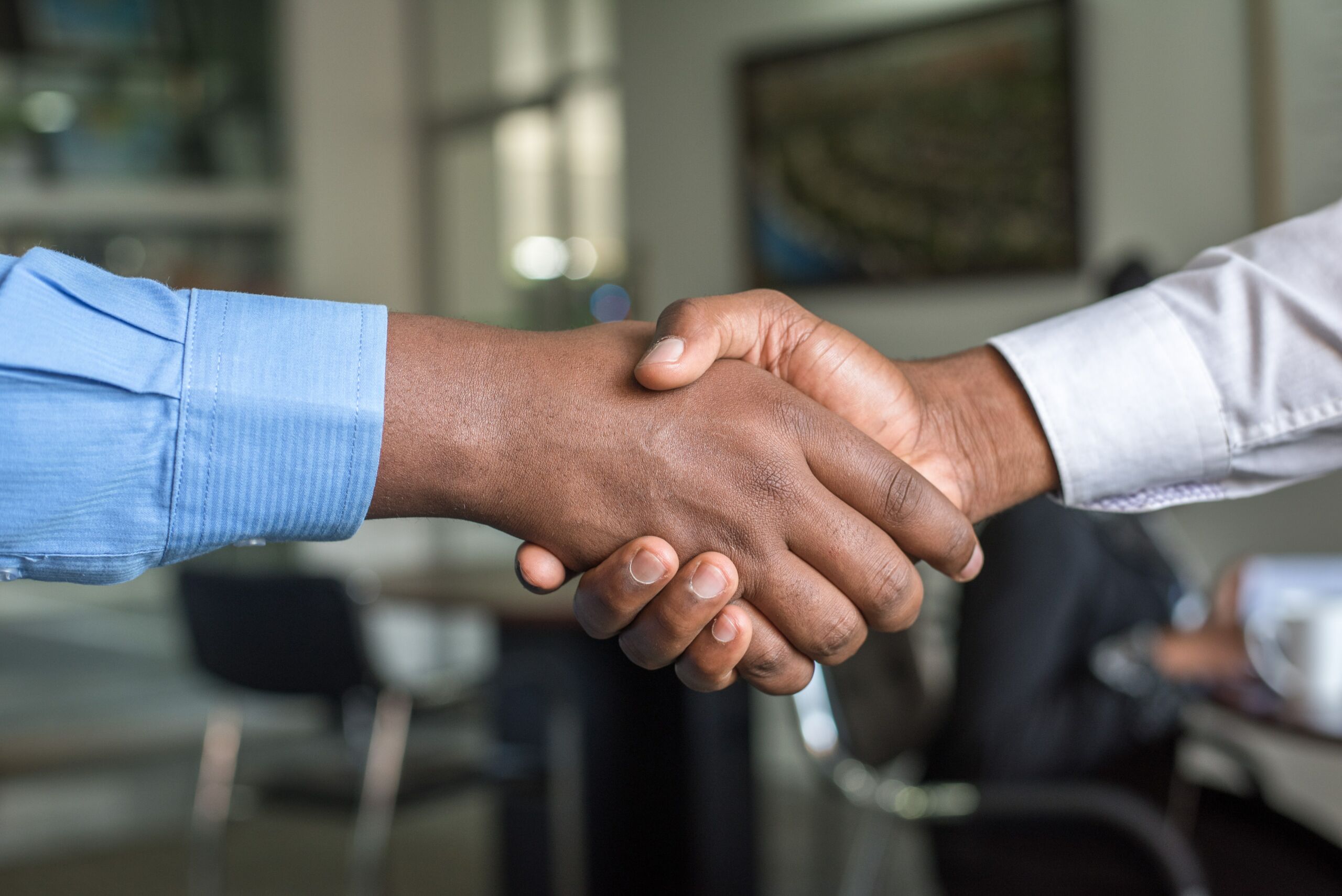 a close up of a hand shake