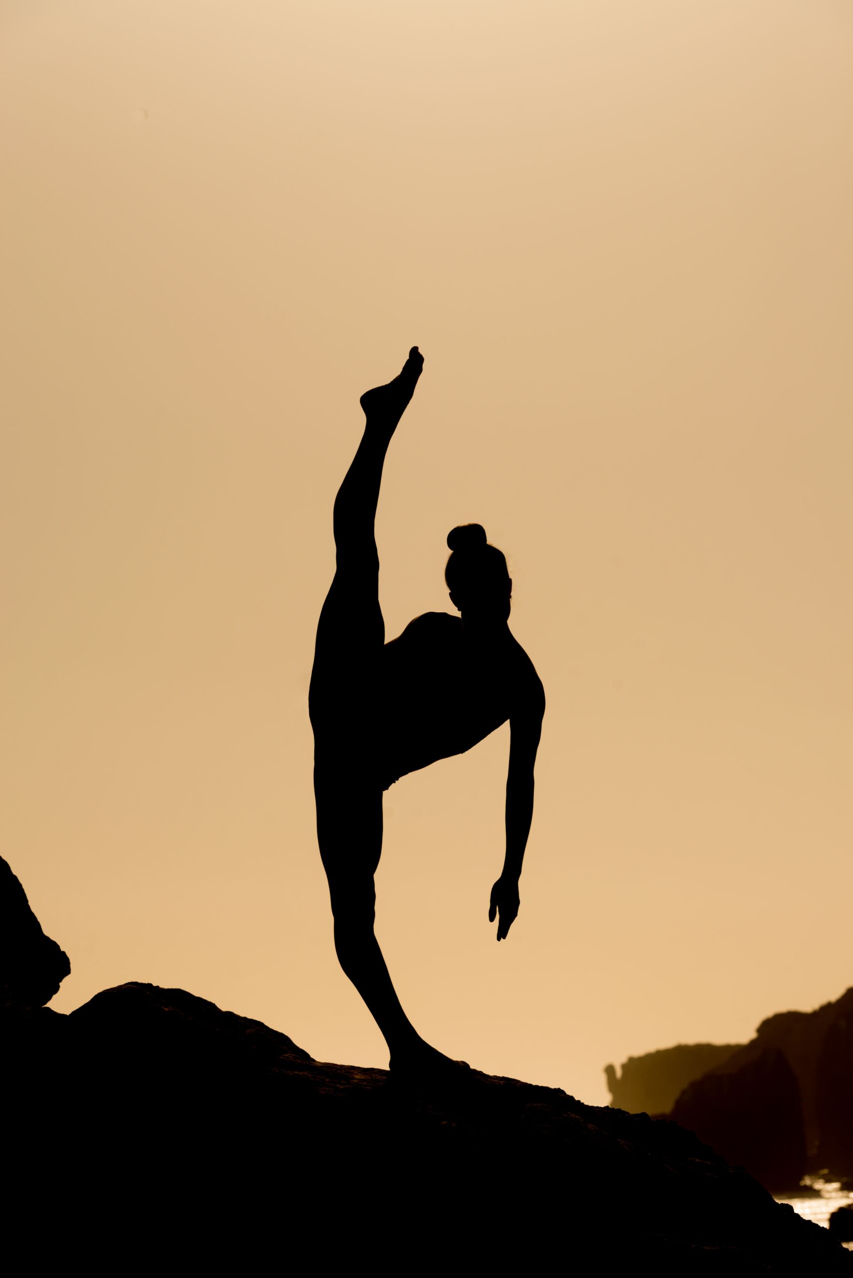 female silhouette doing a yoga pose