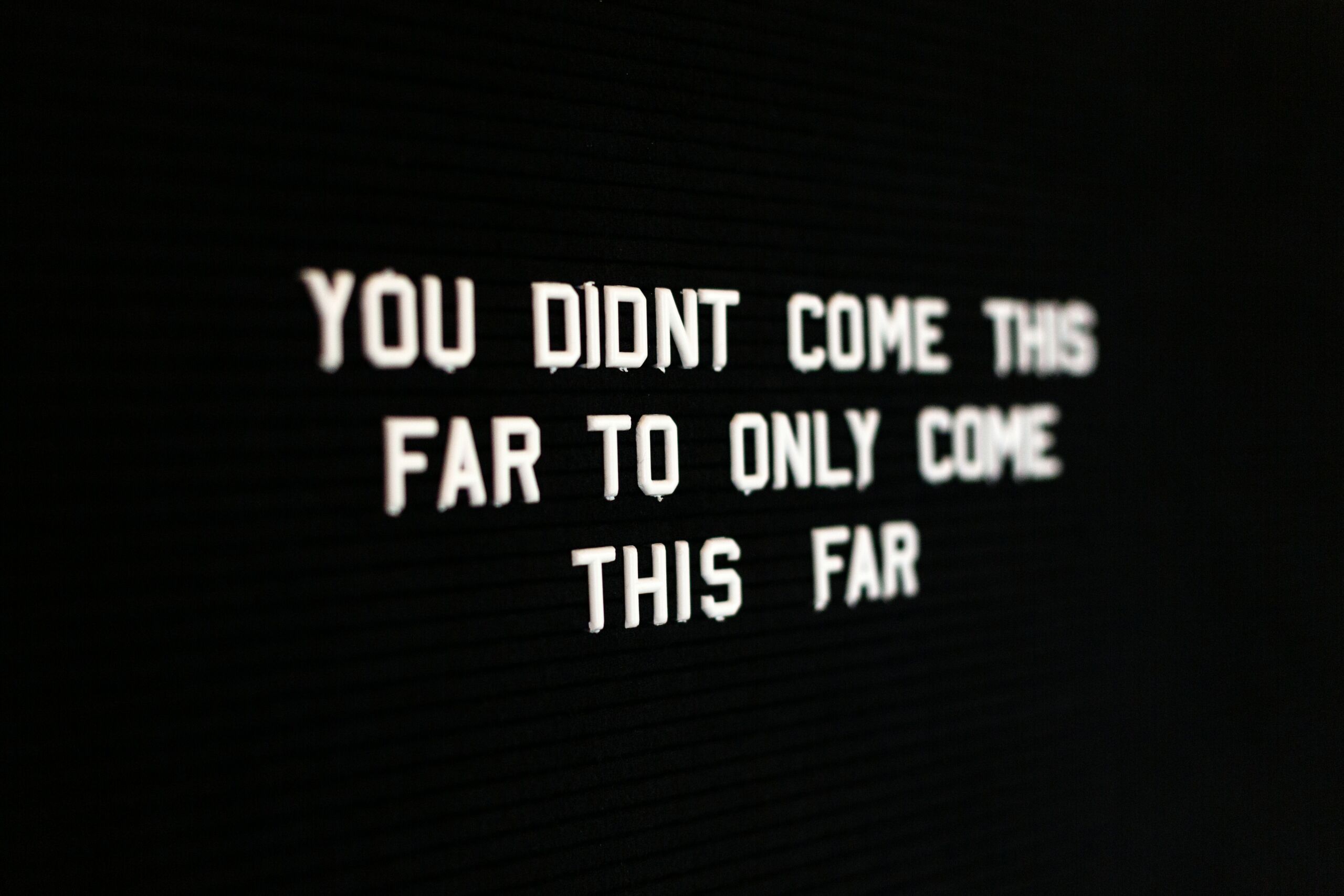 Motivational sign the reads "you didnt come this far to only come this far"
