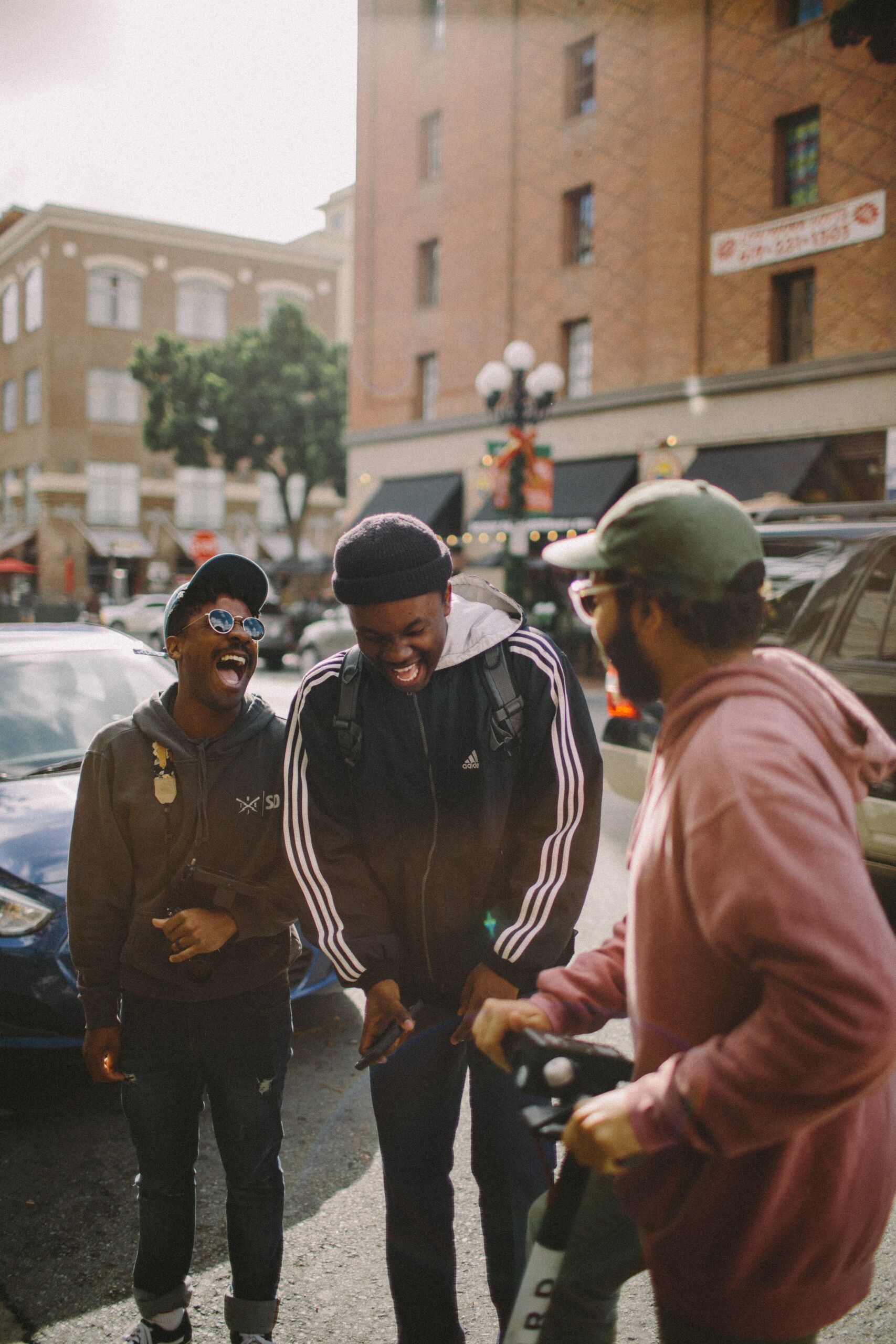 Group of men laughing in a city