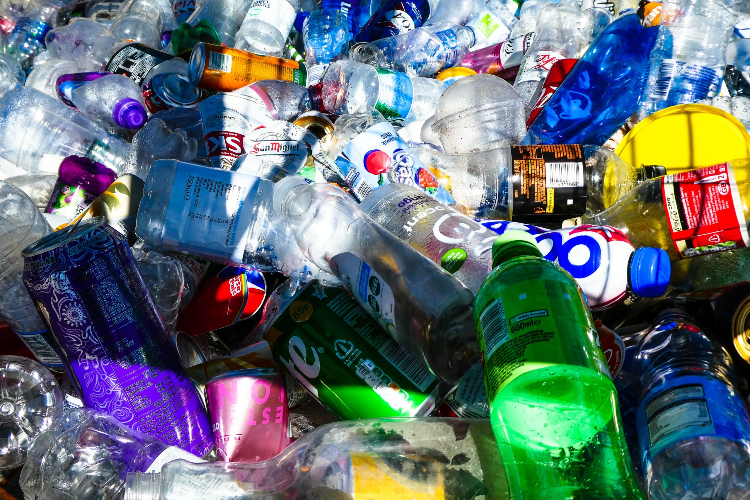 pile of plastic and aluminum bottles