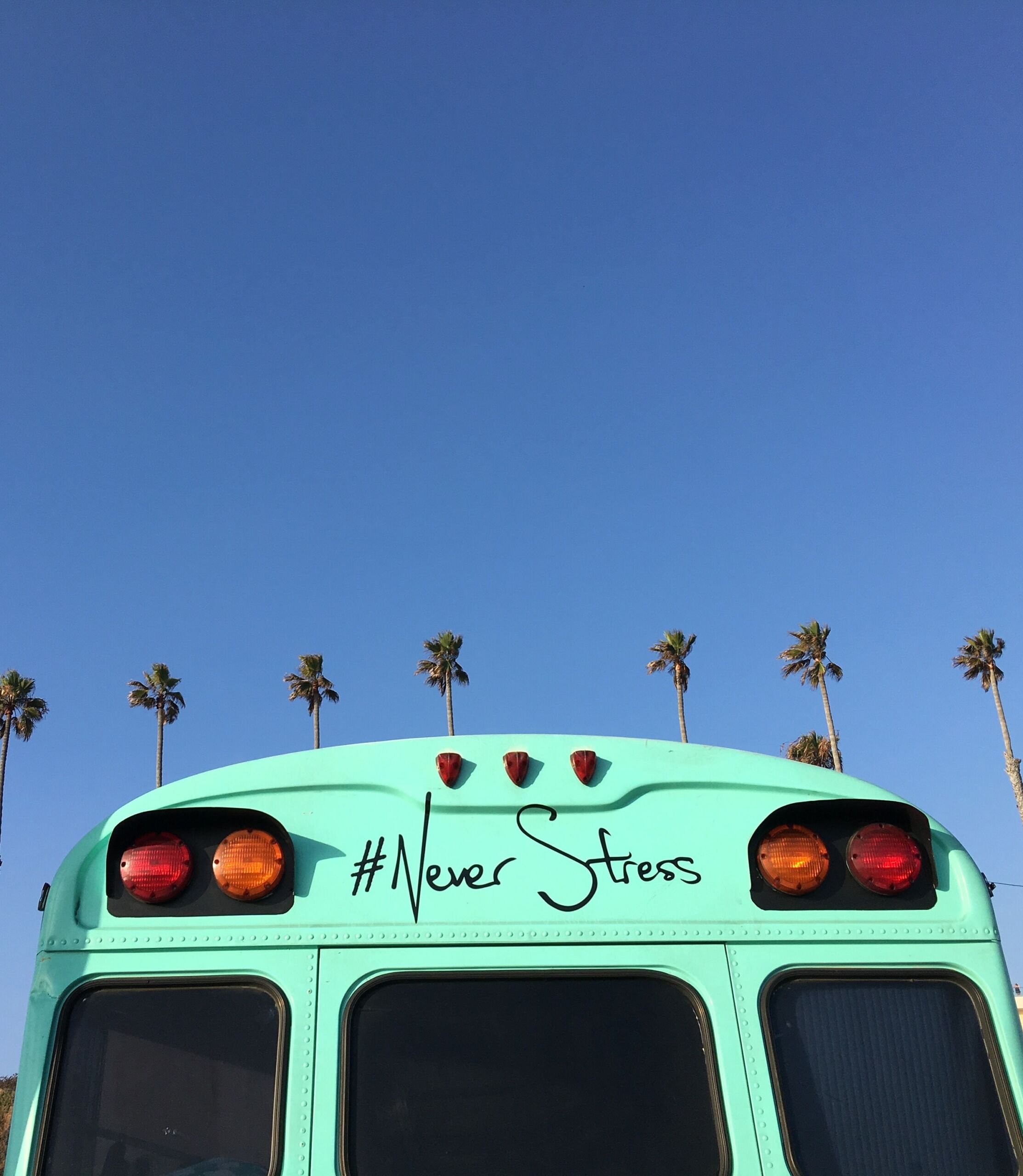 top of bus with #never stress written on the top