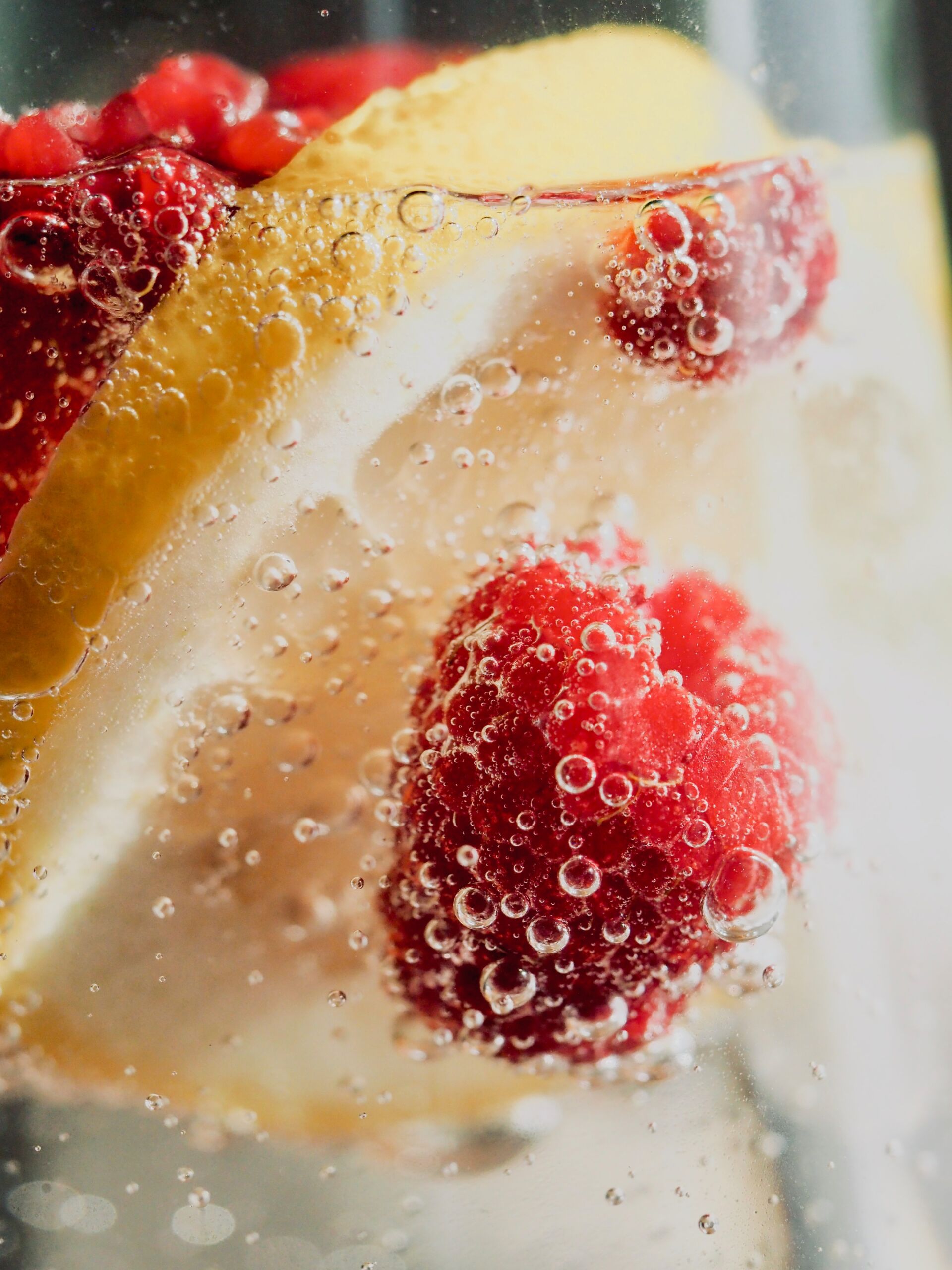 sparkling water with lemon and raspberry in it